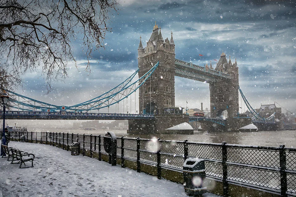 View to the Tower Bridge in London during winter time with a heavy snow storm