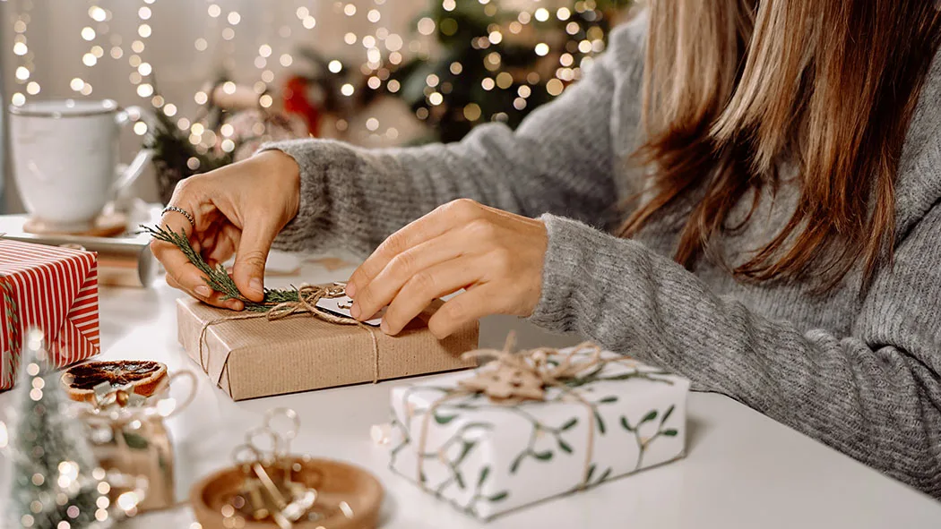 Woman wrapping Christmas gifts