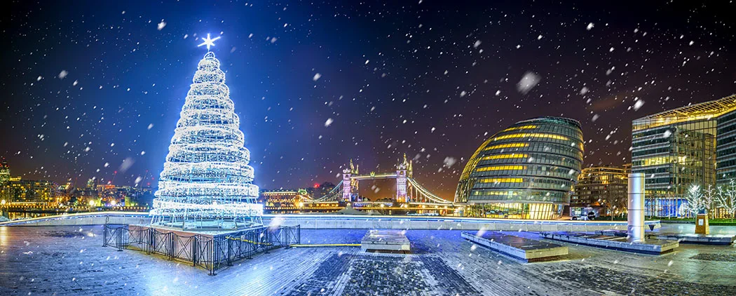 Morgan's lane panorama with Christmas tree and falling snow in London, UK